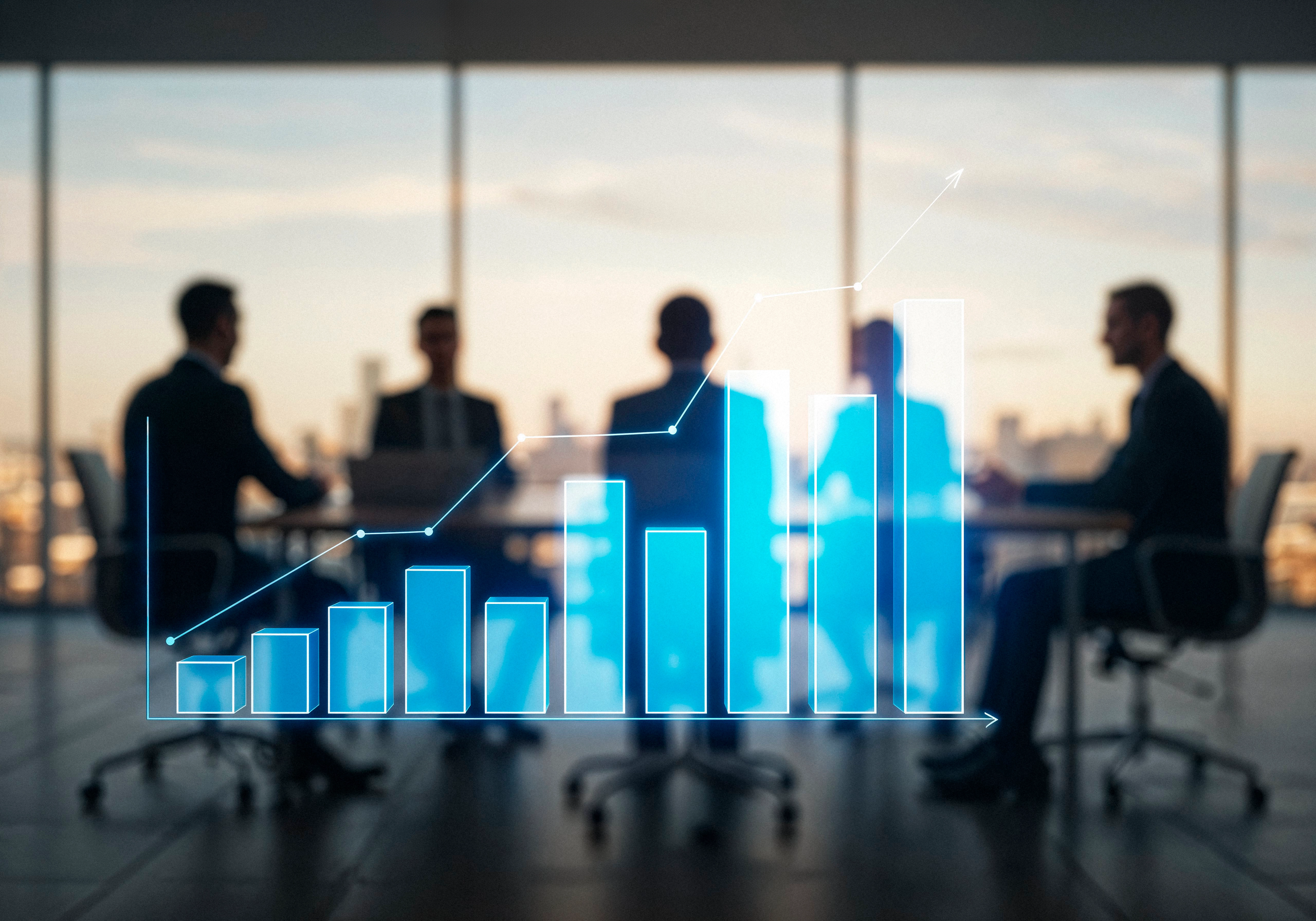 Blurred silhouettes of people in a boardroom meeting at sunset with a blue ascending chart overlay